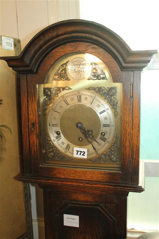 An oak cased chiming grandmother clock